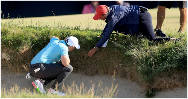 Two golf players on a golf course.